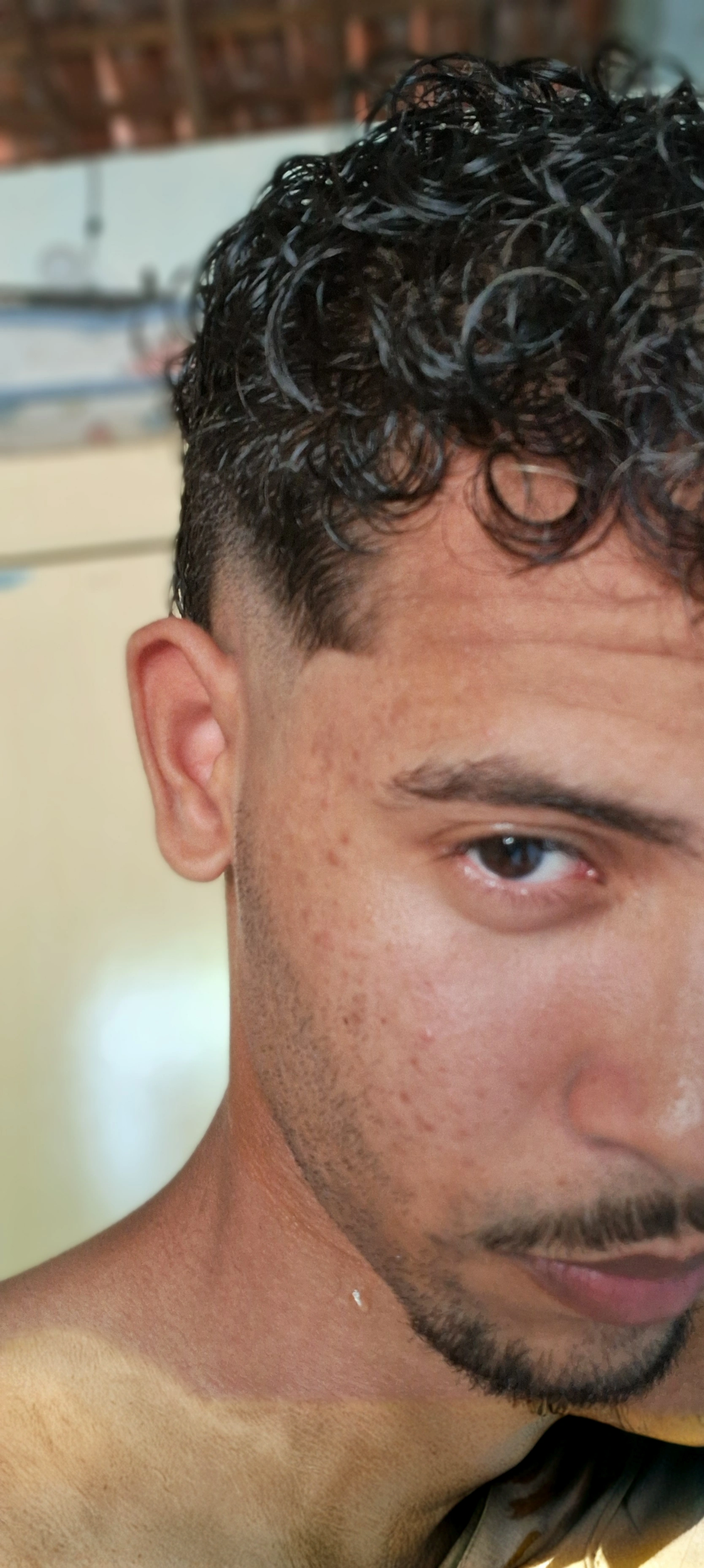 there is a man with a beard and a shirt on, left ear, side of head, gauged ears, pointed ears, closeup at the face, pointy ears, slightly - pointed ears, pale pointed ears, two pointed ears, buzzed hair on temple, close up at face, pimples, small nose with freckles, face!!!! close - up