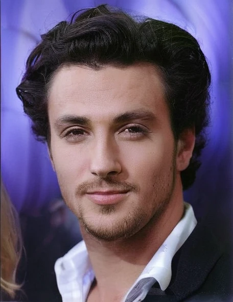 A man on the beach, strong big haired blonde 