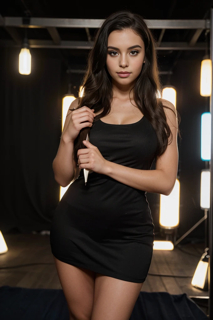 A photorealistic portrait of a 21-year-old Colombian girl with long, flowing dark hair and striking dark eyes. She should have a playful, radiant expression and be illuminated by the flashing lights of a nightclub photo booth. The background should depict a stylish, modern photo booth area with fun props and a backdrop featuring the club's logo. She is posing for a photo with friends, one hand on her hip and the other holding a prop, wearing the same chic, form-fitting black dress and her hair styled in loose waves. Capture this moment with a high-resolution photograph using an 85mm lens to emphasize her playful spirit and the lively photo booth setting.
