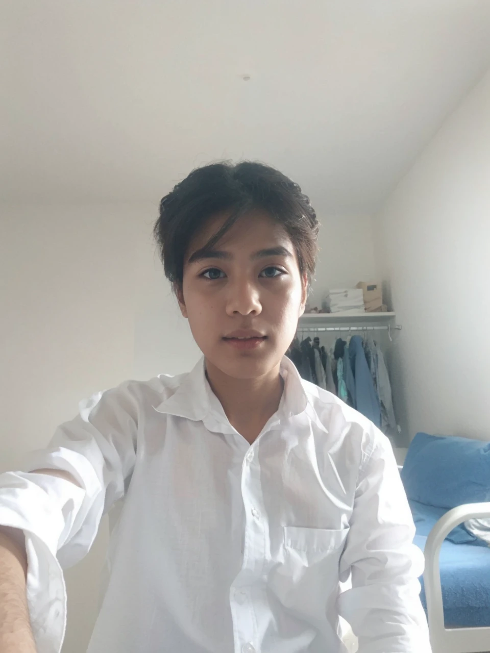 Front photo with white background, wearing white dress shirt