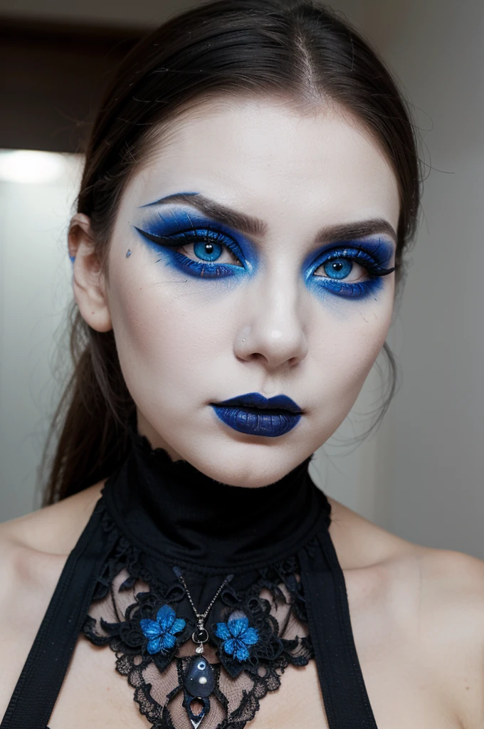 a traditional goth girl with blue eyes, white face makeup and very big eyeliner