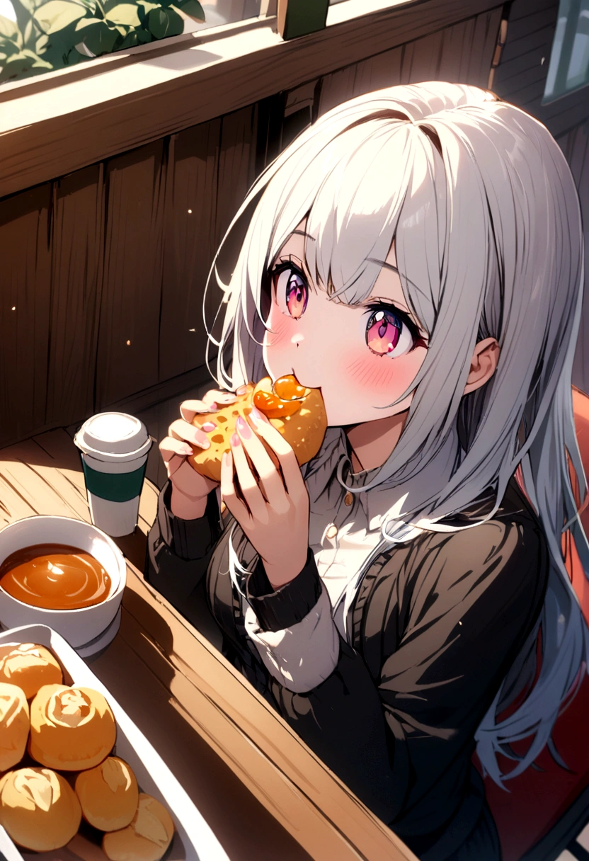 A girl eating snack in caffe