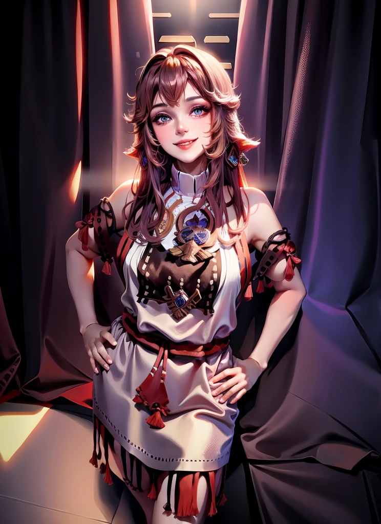 A woman is standing against a black curtain background, wearing a beige and brown fringed dress with blue accents. Her hair is dark, styled in loose waves, and she's smiling at the camera.