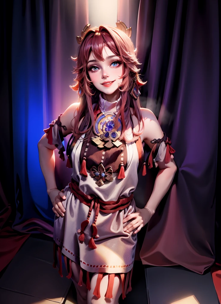 A woman is standing against a black curtain background, wearing a beige and brown fringed dress with blue accents. Her hair is dark, styled in loose waves, and she's smiling at the camera.