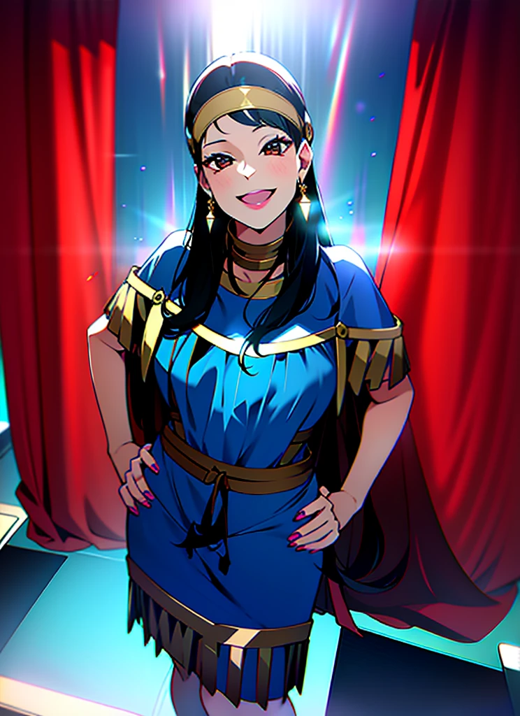 A woman is standing against a black curtain, smiling at the camera. She has long dark hair and is wearing a brown dress with fringe details on the sleeves and hem. The dress features a blue belt and a matching blue headband adorned with feathers. Her pose suggests she's posing for a photo.
