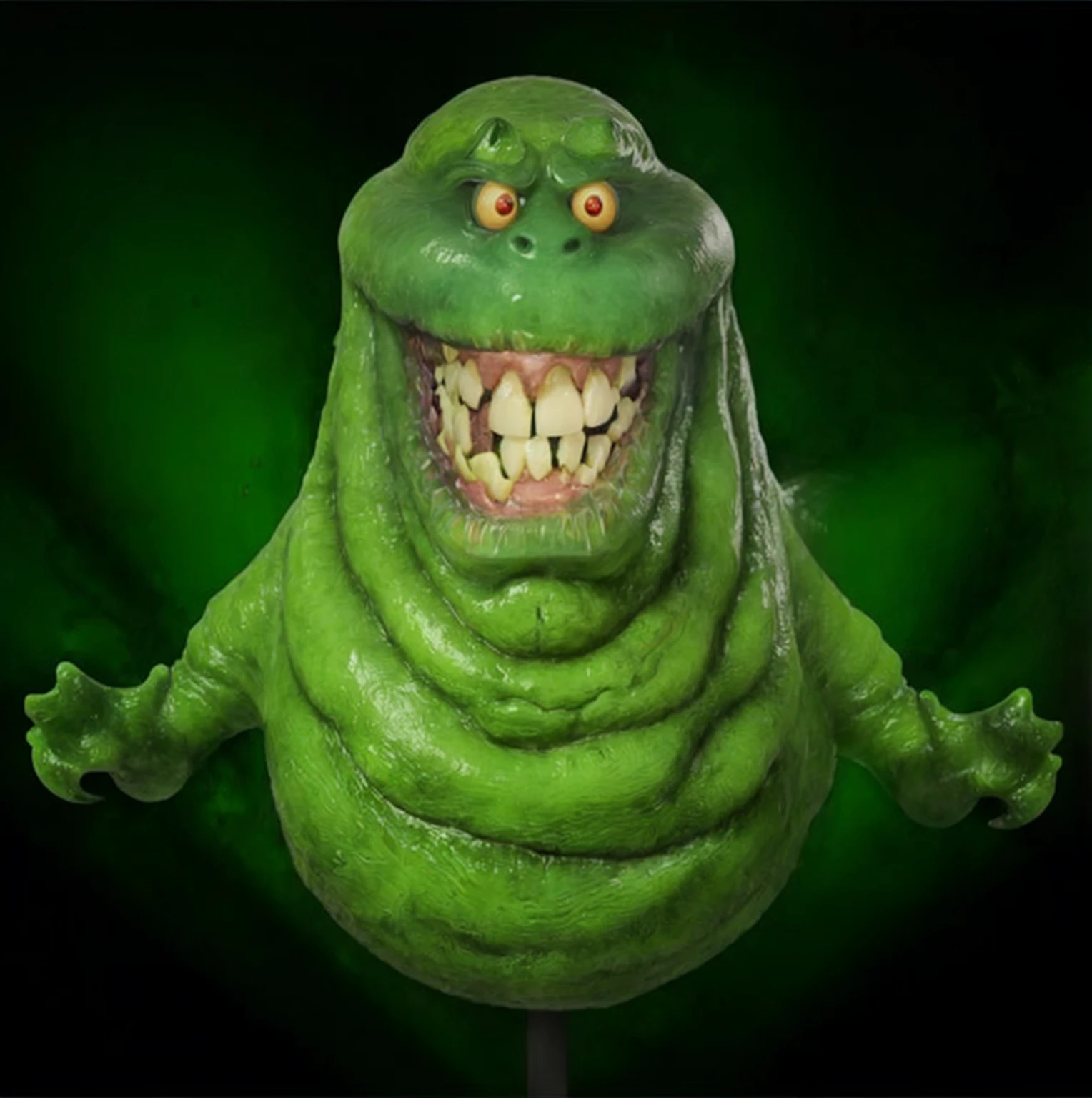 a close up of a green creature with a big smile on its face, thinner, gelatinous texture,ghostbusters character, slime monster,