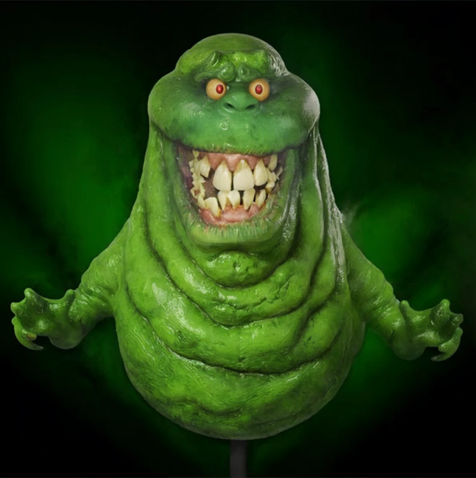 a close up of a green creature with a big smile on its face, thinner, gelatinous texture,ghostbusters character, slime monster,
