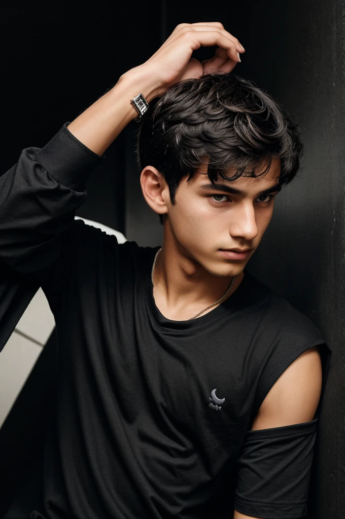 A boy of was wearing a black shirt who was in dark background with arm was put near face like a pose and wearing a watch