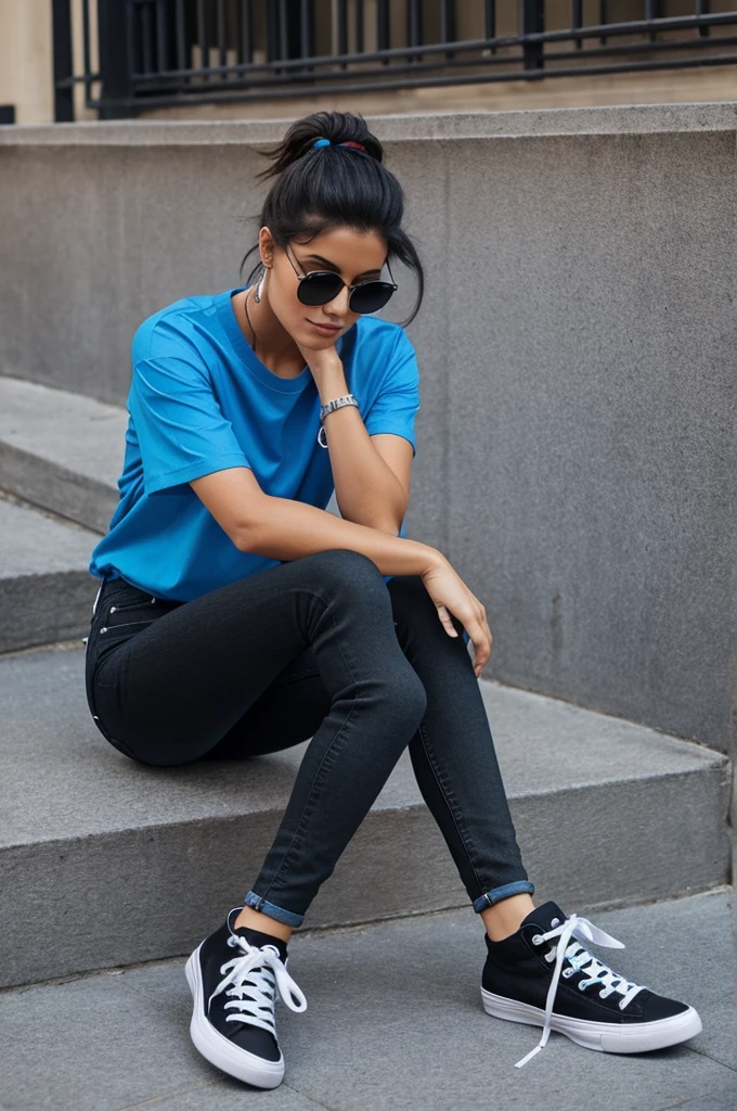 Create a look with a blue t-shirt, black jeans and black high-top sneakers.