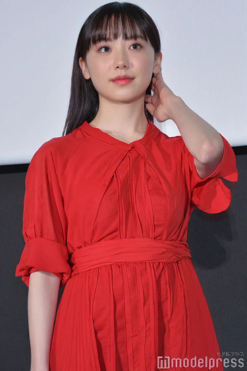 A close up of a woman in a red dress posing for a picture - SeaArt AI