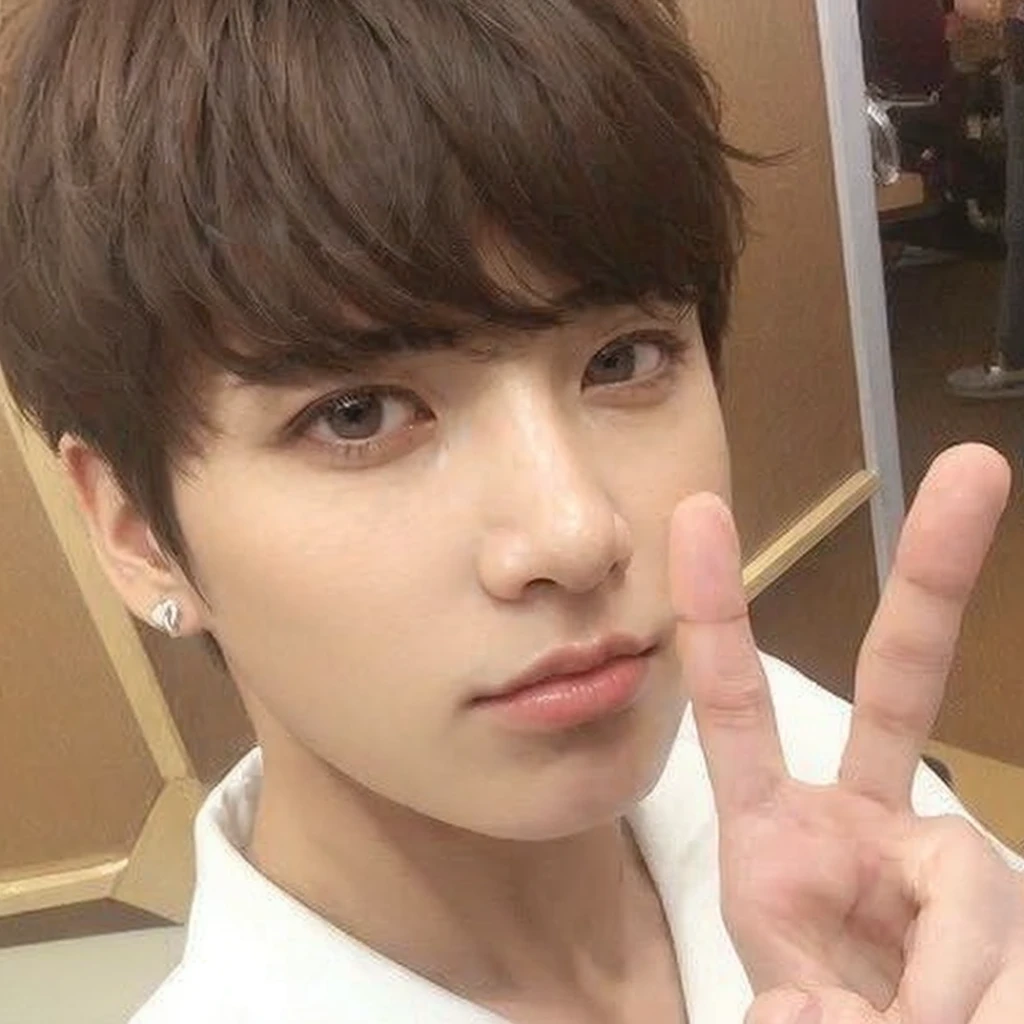 Jungkook from BTS with extremely attractive and handsome face, with adorable eyes.