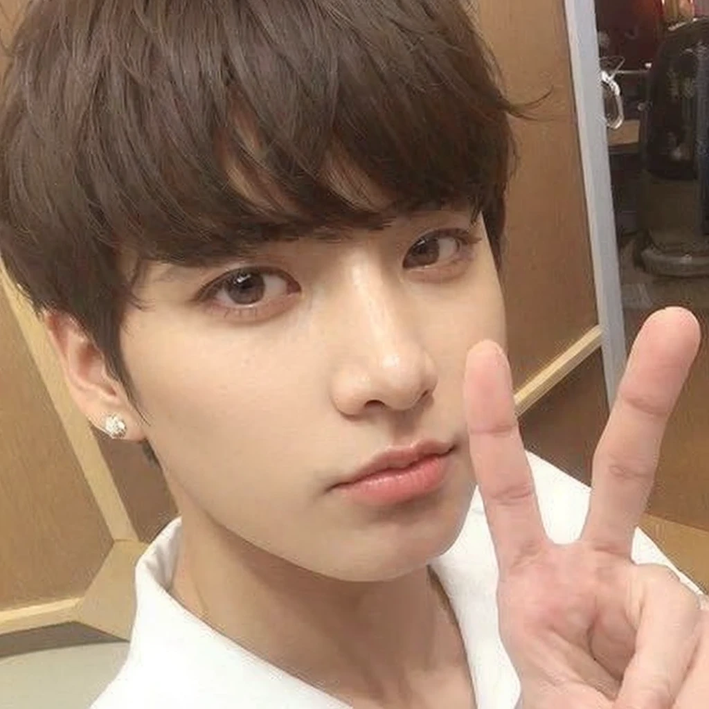 Jungkook from BTS with extremely attractive and handsome face, with adorable eyes.