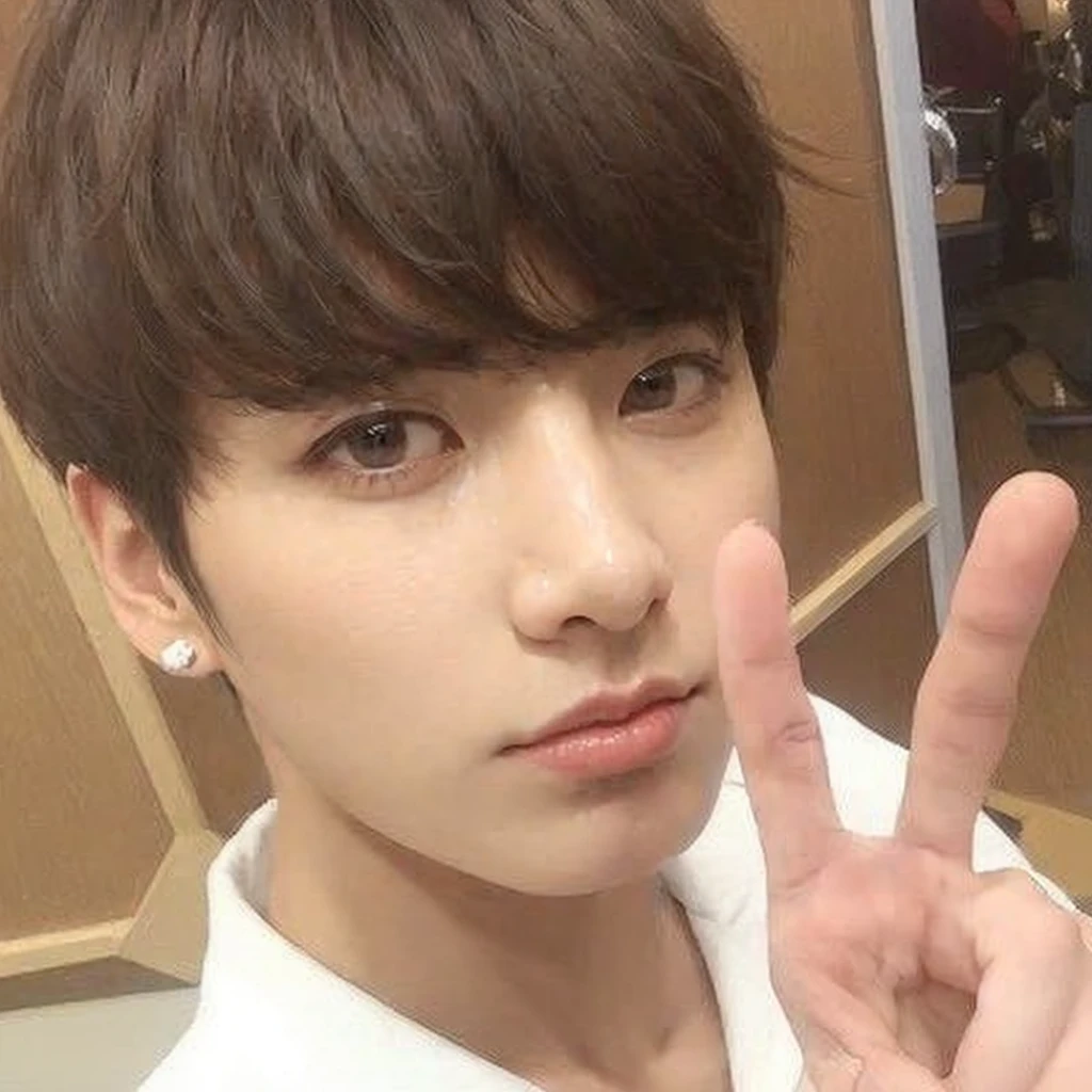 Jungkook from BTS with extremely attractive and handsome face, with adorable eyes.
