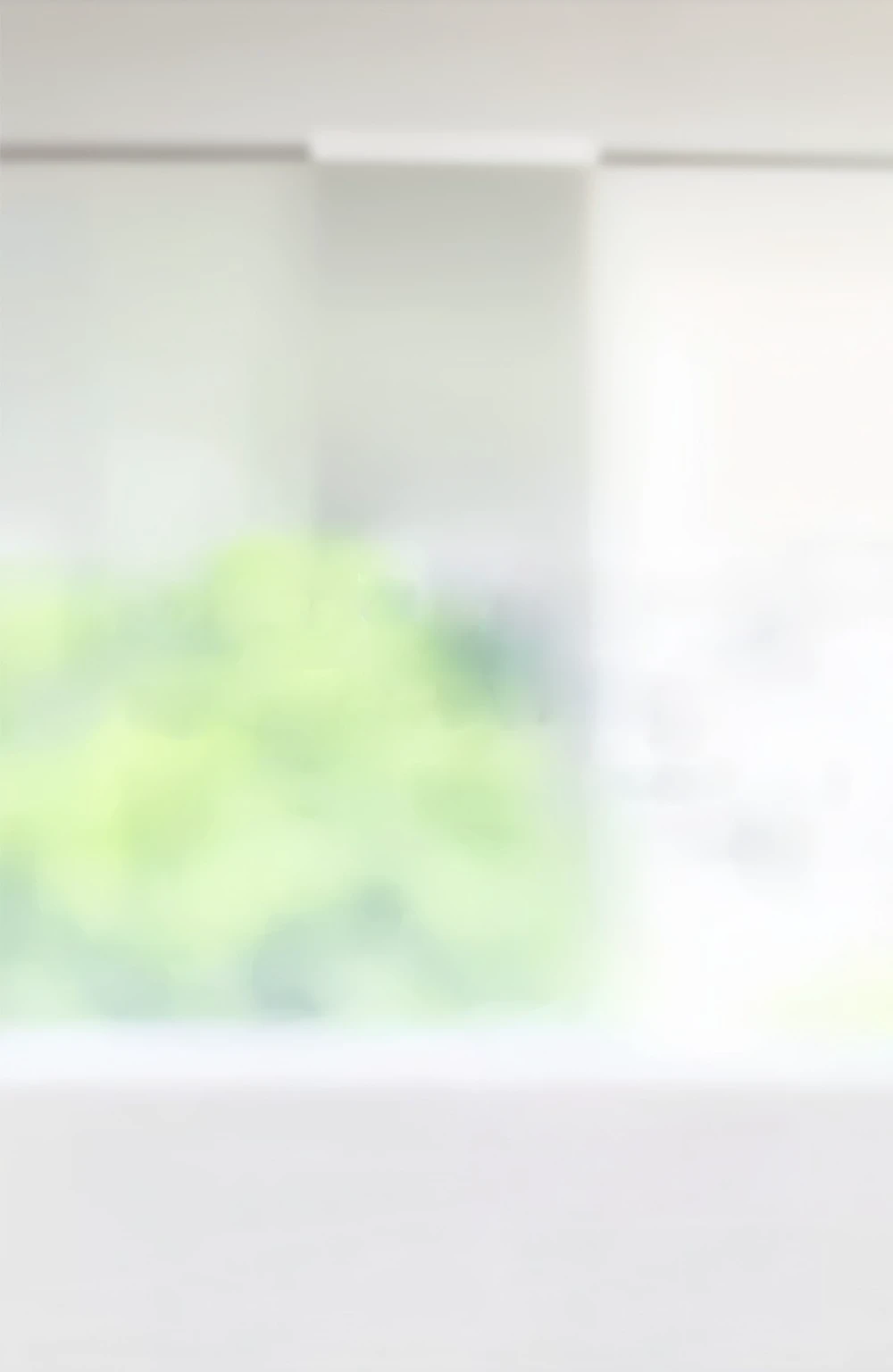 There is a little teddy bear sitting on the bed in front of the window, Blurred environmental background, out of focus background, out of focus background, blurry distant background, Blurred background, blur background, some Background blur, Blurred background, Background out of focus, White background, Blurred Background, Blurred Background, Background blur, Background blur