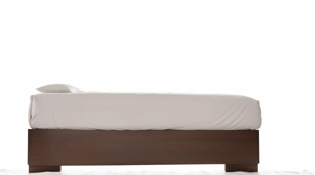 Bed without blanket on white background
