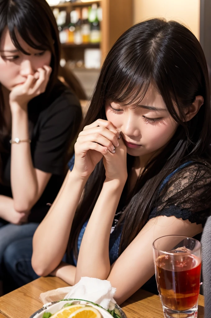 crying girl、Drinking alcohol while being comforted by friends