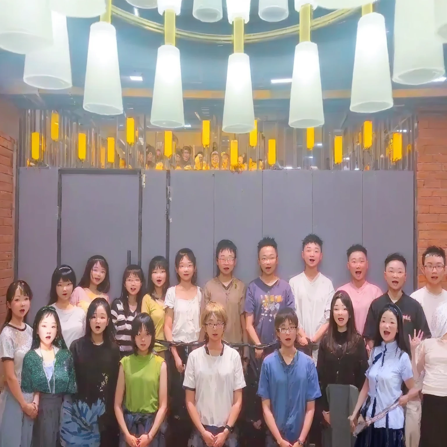 there are many people standing together in a room with lights, group photo, anime, happy
