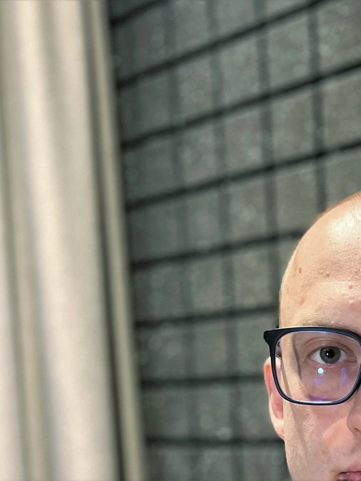 man against the background of a company office
