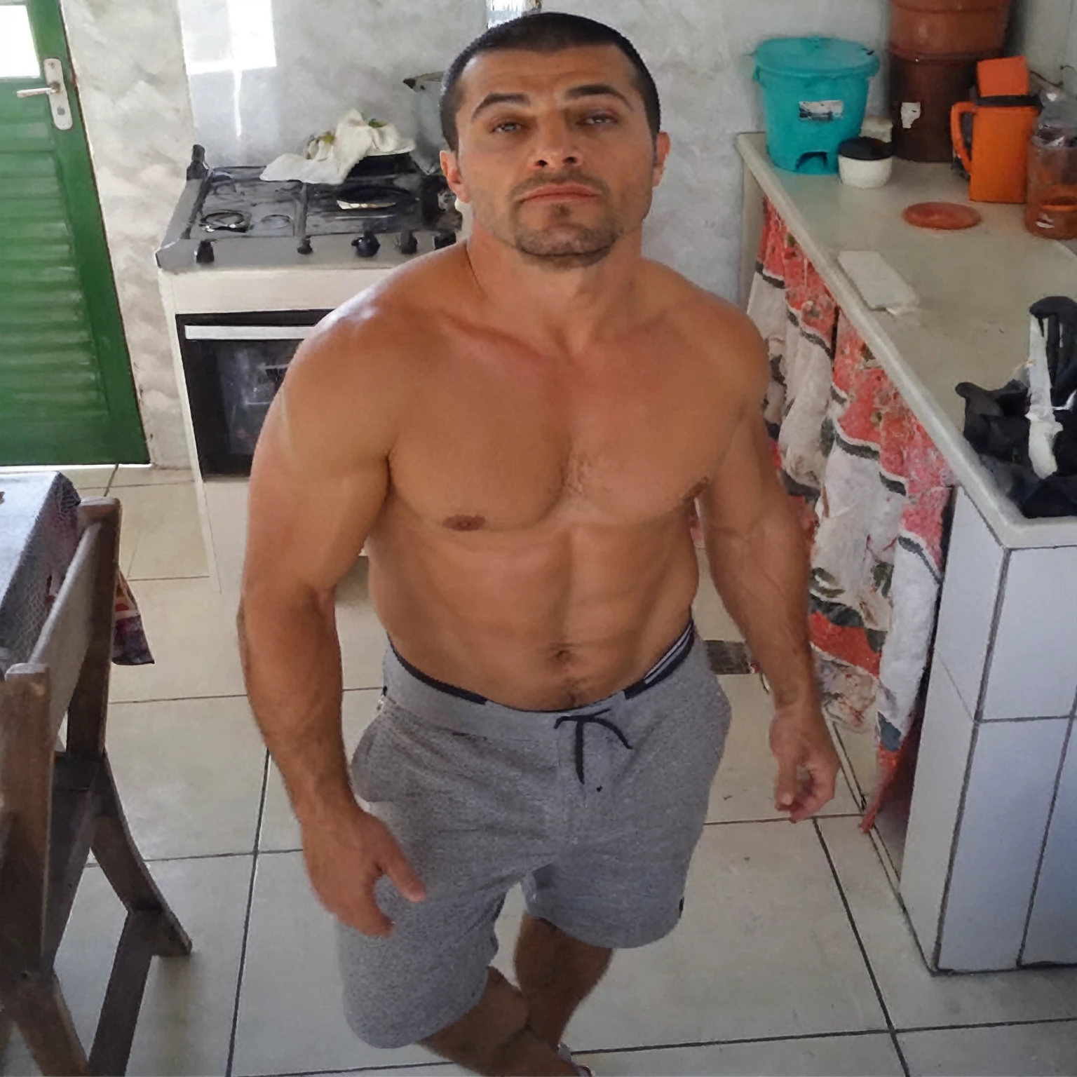 "(best qualityer,realisitic:1.37),portrait of a 35 year old person, dark-haired man, Buzz Cut, intense gaze,detailedeyes,eyes browns,Detailed lips,strong facial features,fine wrinkles,natural lighting,strong chin,determining expression,subtle stubble,neutral background,bright coloured"