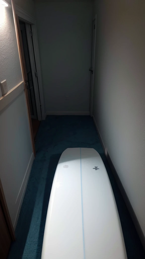 White surfboard on a bed in a dark environment photo as if taken by cell phone camera