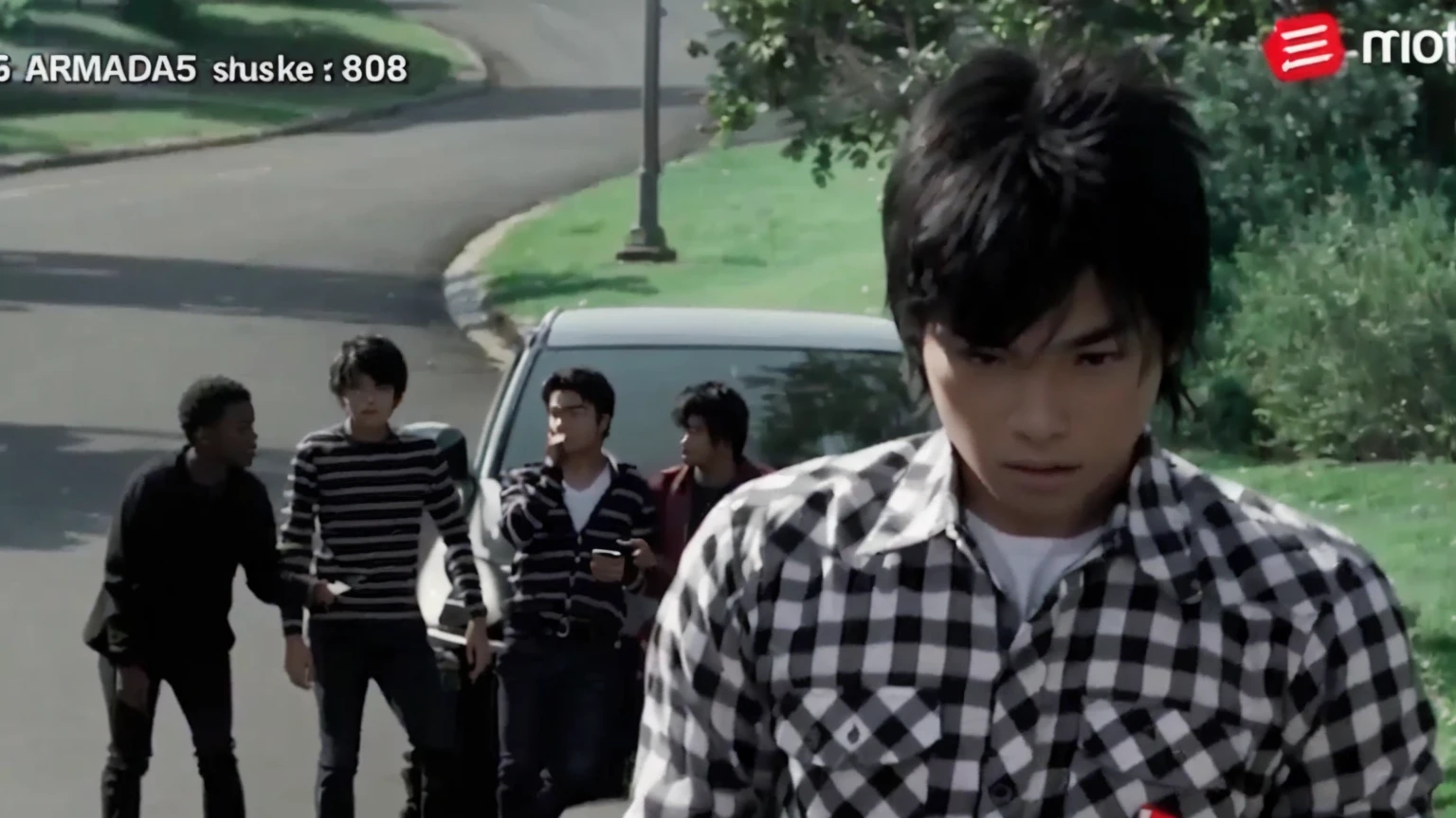 there is a young boy walking down the street with a cell phone, movie screen shot, still from a music video, scene from live action movie, movie screencap, movie screenshot, screenshot from a movie, still from a live action movie, youtube video screenshot, highlight scene of the movie, opening scene, screen capture, ultra sharp, screen cap