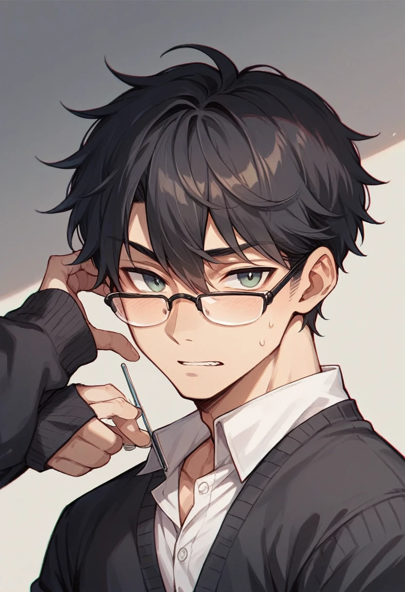 Boy in glasses wearing black cardigan