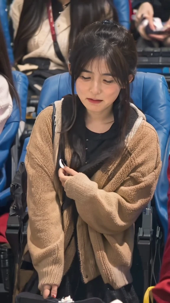 A Japanese girl in her 20s is crying while watching a movie at the cinema