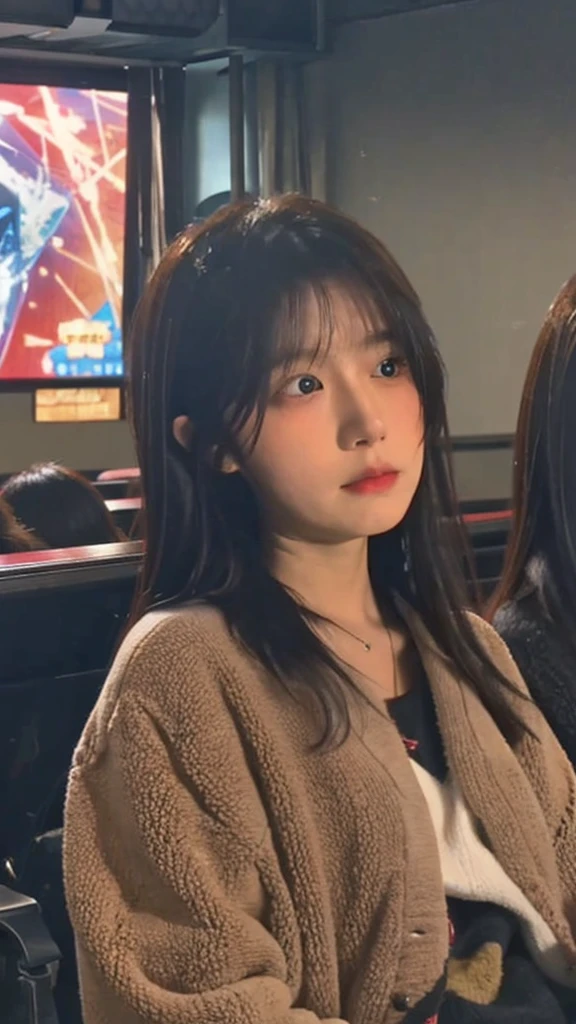 A Japanese girl in her 20s is watching a movie in a dimly lit movie theater, her face illuminated by the light of the screen, shedding tears