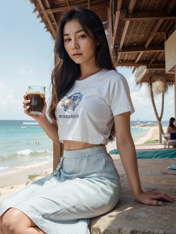 Realistic photo, a woman with a very beautiful Asian face, long hair in the booth looks beautiful with the wind blowing her hair, sitting on a large rock, holding a cup of coffee. wearing a white t-shirt and a long skirt with a unique motif, the beautiful beach can be seen against the backdrop of the people around you, a masterpiece, the best quality