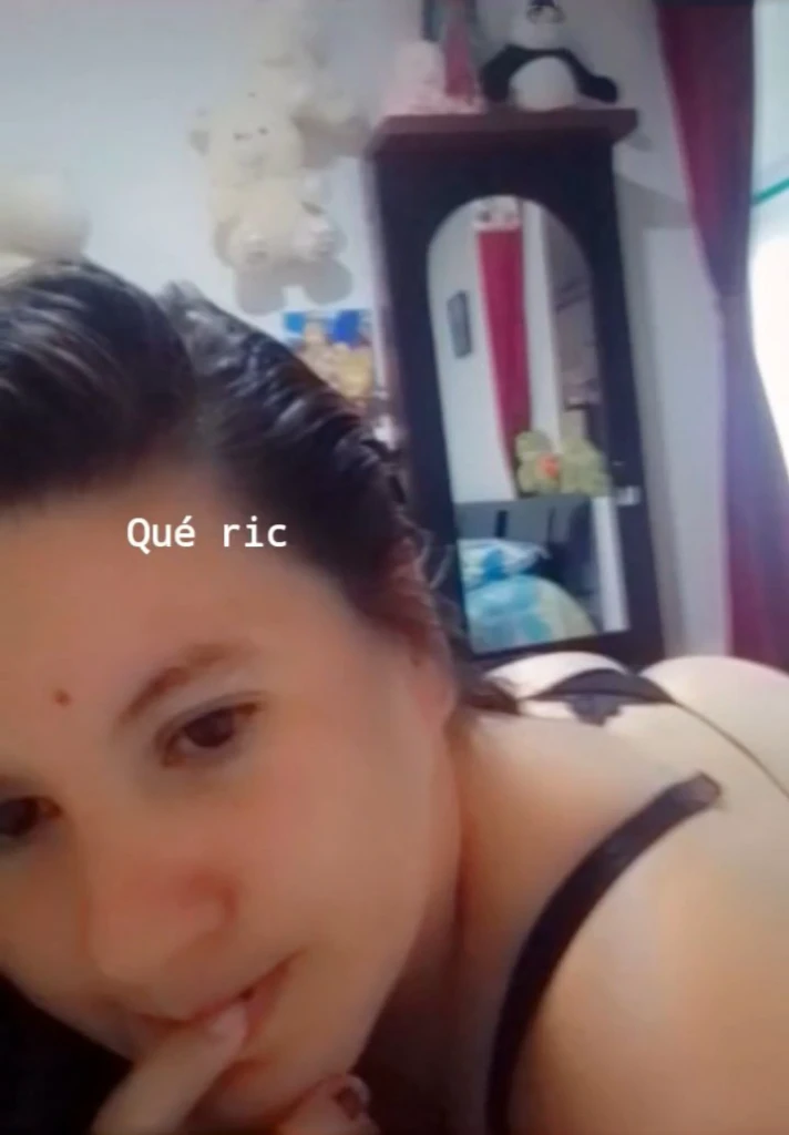 She is taking a selfie, just wearing a thong, showing her ass