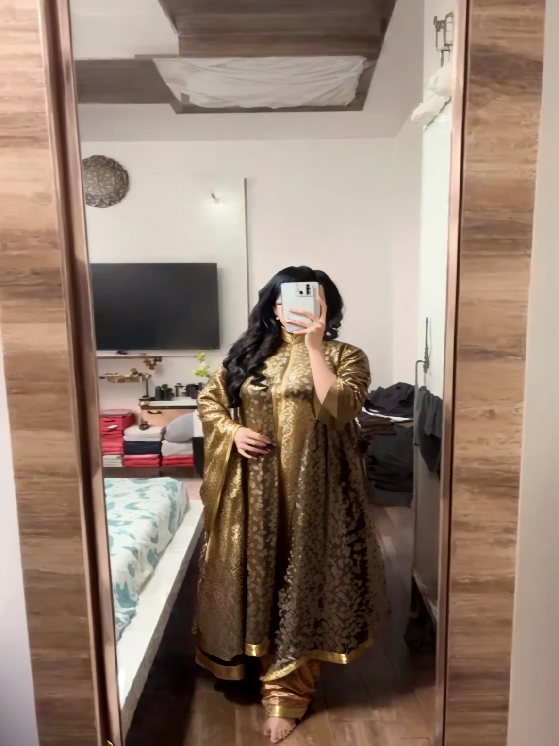 a woman taking a selfie in a mirror in a room, wearing a silk kurta, wearing a kurta, full covered dress, outfit photo, wearing a fisher 🧥, full body photogenic shot, full body picture, wearing jedi robes and a sari, 8k selfie photograph, fully covered in drapes, wearing an elegant tribal outfit, full dress