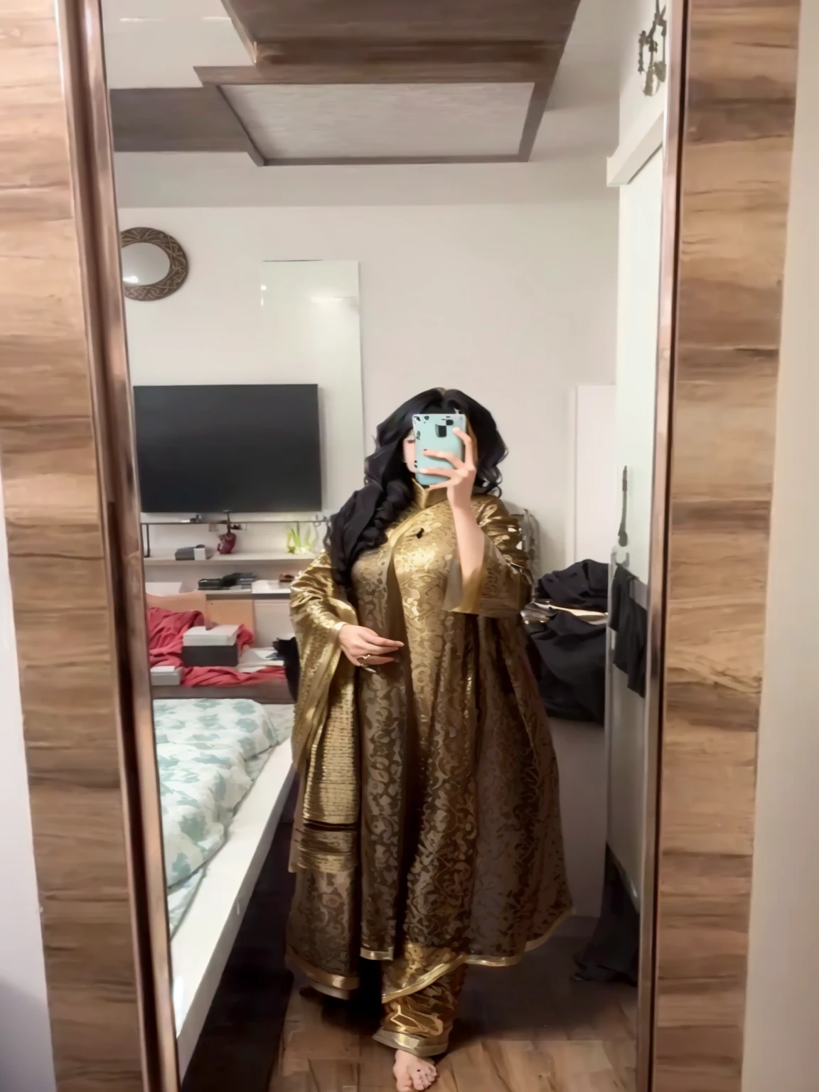 a woman taking a selfie in a mirror in a room, wearing a silk kurta, wearing a kurta, full covered dress, outfit photo, wearing a fisher 🧥, full body photogenic shot, full body picture, wearing jedi and a sari, 8k selfie photograph, fully covered in drapes, wearing an elegant tribal outfit, full dress