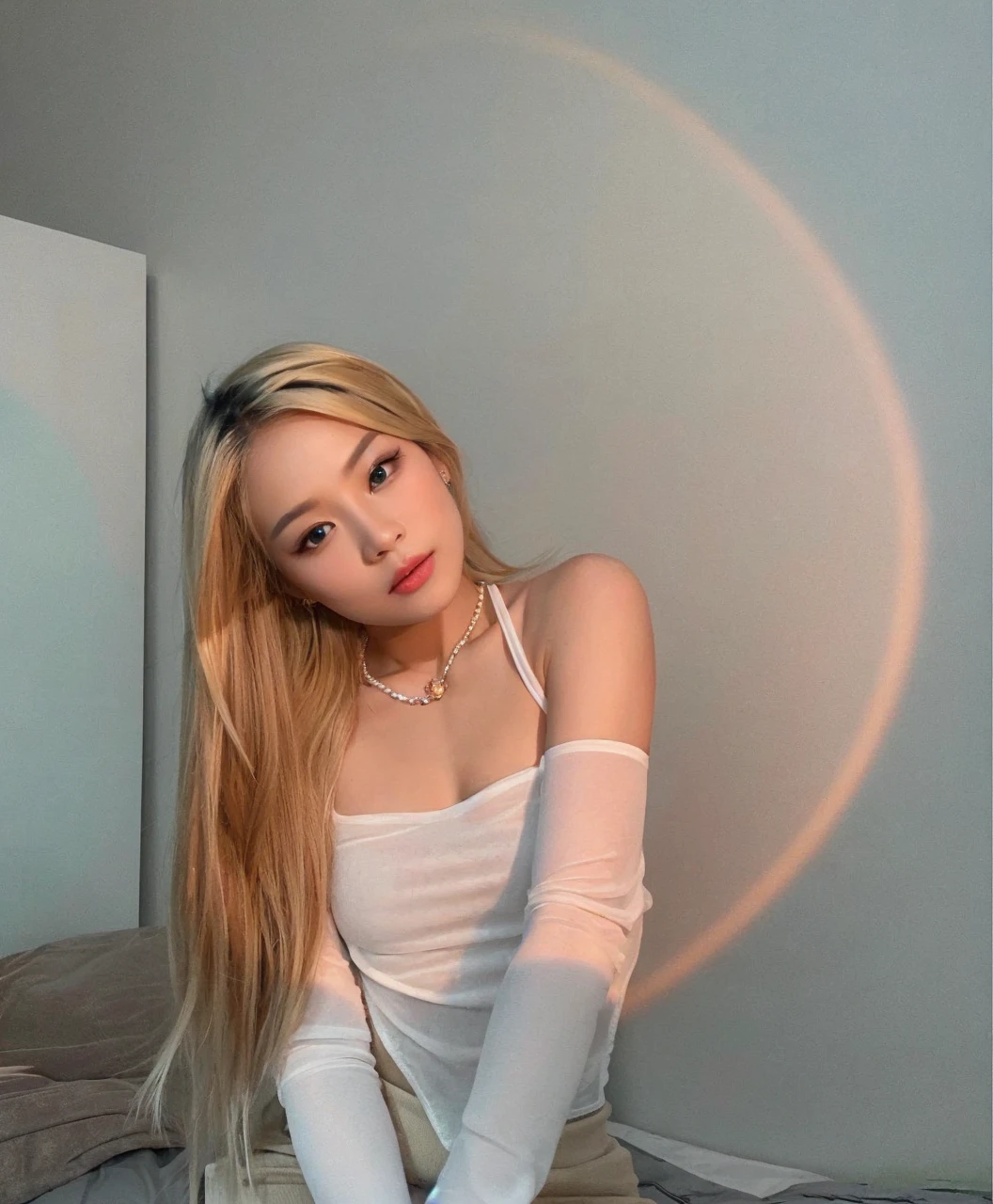 Asian model girl with blonde hair, fair skin and large black expressive and engaging eyes. Her features are delicate, with subtle cheekbones, a small nose and full, rosy lips. Her expression combines sweetness and seduction, resulting in a cute, sexy and beautiful appearance.