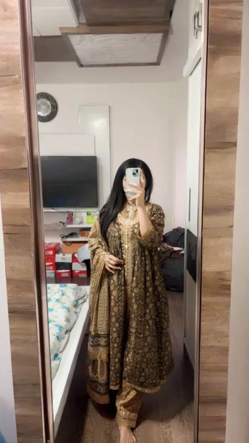 a woman taking a selfie in a mirror in a room, wearing a silk kurta, wearing a kurta, full covered dress, outfit photo, wearing a fisher 🧥, full body photogenic shot, full body picture, wearing jedi robes and a sari, 8k selfie photograph, fully covered in drapes, wearing an elegant tribal outfit, full dress