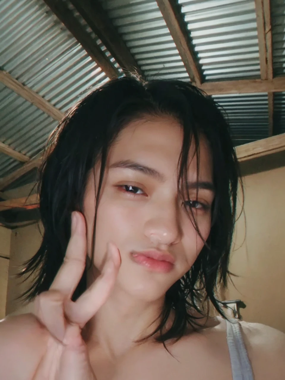 (photorealistic, masterpiece, 8K, HD, portrait, closing up on face, intricate details, soft lighting, absurdres), a handsome young vietnamese man, soldier, 25 years old, strong, brave, determined, confident, manly, intimidating, mischievous, hot, attractive, smirking, detailed face, red eyes, detailed eyes, sharp eyes, looking at viewer, wearing a jacket with rolled up sleeves over a shirt, casual wear, glasses, tanned skin, fit, black hair, short hair, spiky hair, outdoors, pier, dawn, stars, constellation, cosmical, dreamy world, surrealism, ethereal