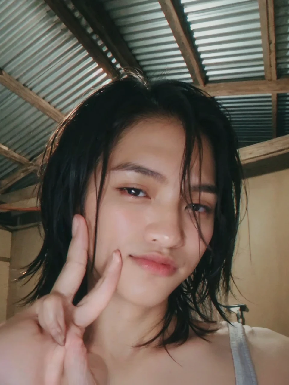 (photorealistic, masterpiece, 8K, HD, portrait, closing up on face, intricate details, soft lighting, absurdres), a handsome young vietnamese man, soldier, 25 years old, strong, brave, determined, confident, manly, intimidating, mischievous, hot, attractive, smirking, detailed face, red eyes, detailed eyes, sharp eyes, looking at viewer, wearing a jacket with rolled up sleeves over a shirt, casual wear, glasses, tanned skin, fit, black hair, short hair, spiky hair, outdoors, pier, dawn, stars, constellation, cosmical, dreamy world, surrealism, ethereal