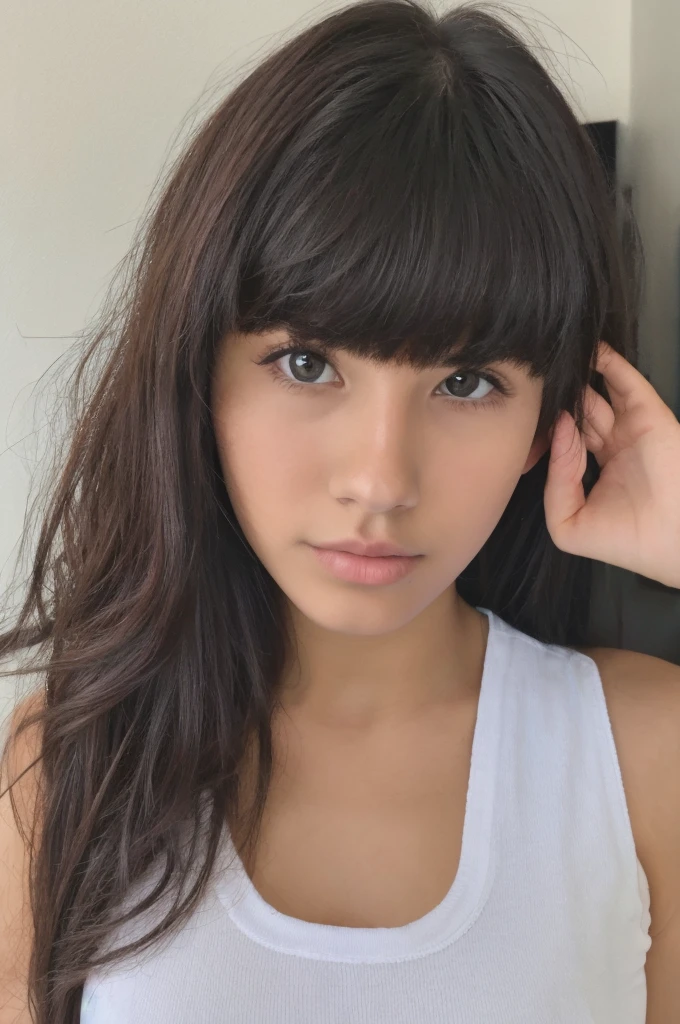 A pretty 17 year old girl with long hair with wavy bangs with a cute and pretty face