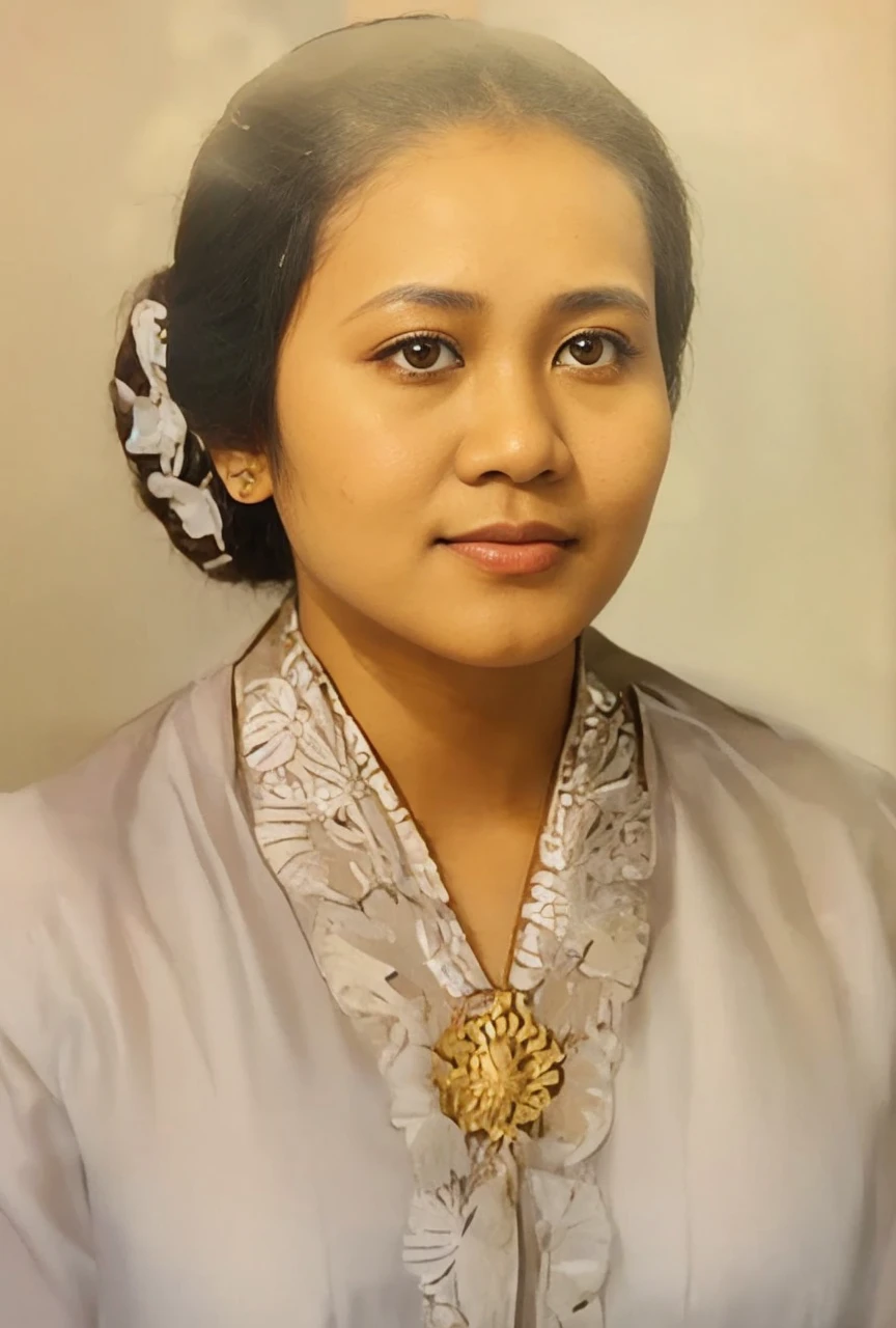 Indonesian woman, aged 20 years or over, brown skin, round eyes, clean oval face, wearing a white kebaya from Indonesian Javanese culture which looks very elegant, hair in a neat bun. Realistic images with HD photo quality