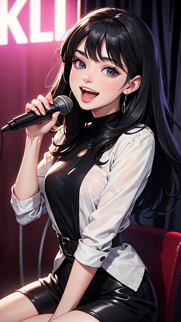 A beautiful black-haired woman laughing with a microphone in a karaoke booth