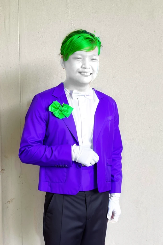 Bright green hair, typically styled in a slicked-back or wild, chaotic manner.
Makeup:
Pale white face, created either by permanent chemical bleaching or makeup.
Exaggerated red lips forming a wide, menacing grin.
Dark eye makeup around the eyes, enhancing his sinister look.
Attire:
Suit: The Joker is most often depicted wearing a purple suit, which includes a purple jacket and matching pants.
Shirt: A green or sometimes orange dress shirt, often with a ruffled front.
Vest: A contrasting vest, often green or yellow, adding to the colorful, clown-like appearance.
Tie or Bow Tie: A green bow tie or a long, thin tie, usually in a bright color.
Gloves: Purple gloves, completing the formal yet flamboyant look.
Shoes: Two-tone dress shoes, typically black and white, or sometimes purple to match the suit.
Accessories:
Flower: Often has a boutonnière on his lapel, which sometimes doubles as a weapon, such as squirting acid.
Cane: Occasionally seen with a cane, adding to his theatrical, over-the-top persona.
Playing Cards: The Joker is known for carrying Joker playing cards, which he uses as calling cards or weapons.
