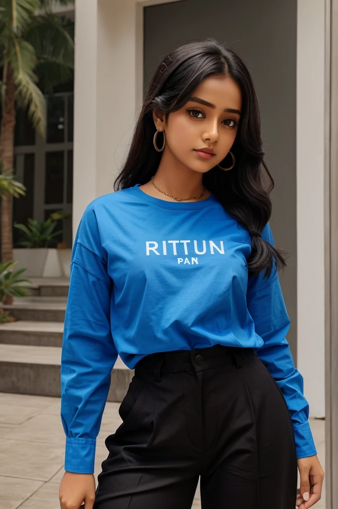 A girl is wearing a blue shirt and black pant. Girl name is written on her shirt that is "Ritu".