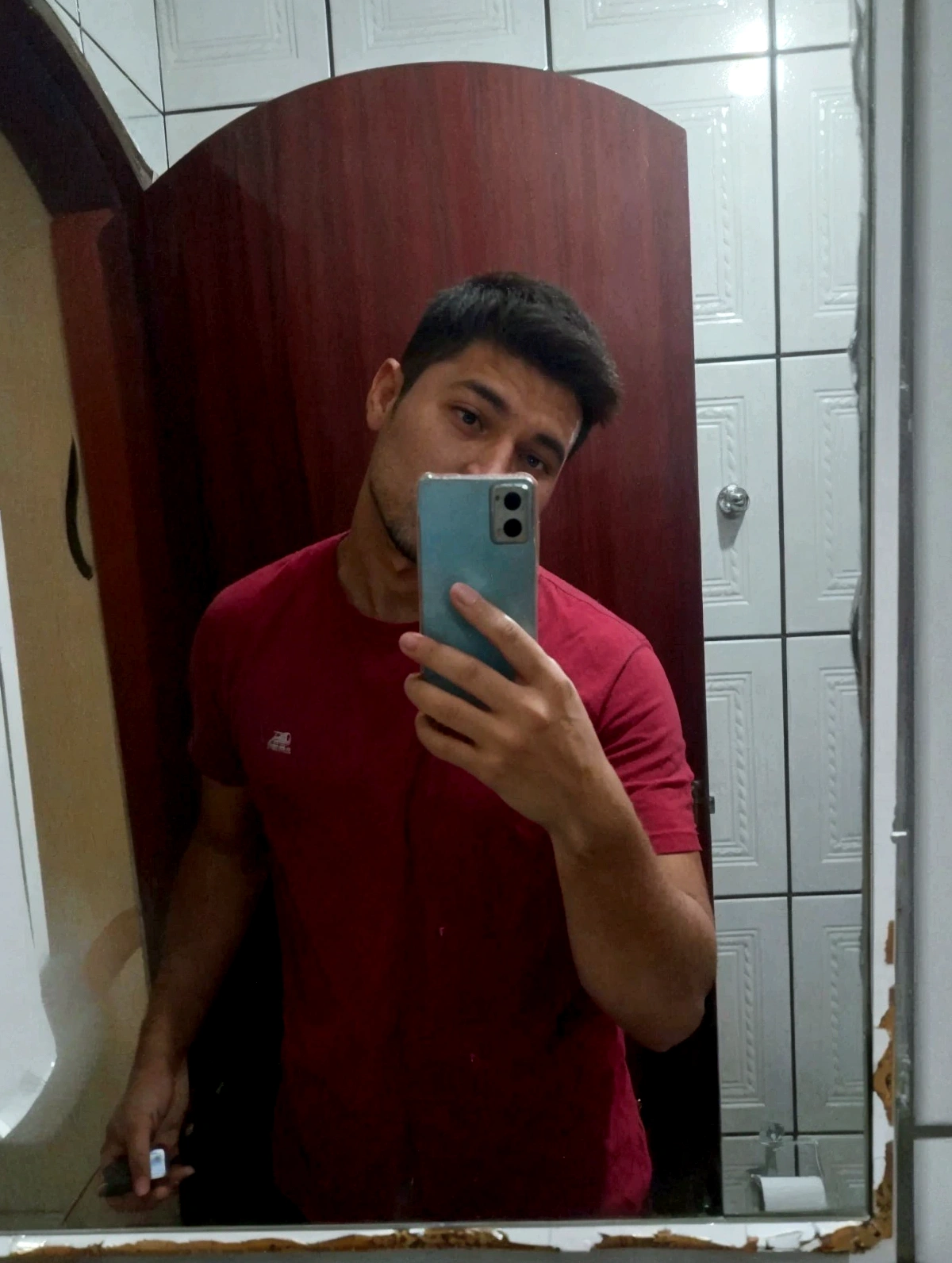 there is a man taking a selfie in the mirror,