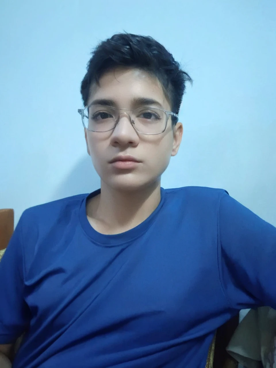 (RAW photo, best quality), (realistic, photo-realistic:1.2), 1girl, high quality, (high detailed skin:1.4), puffy eyes, glasses, gorgeous hair,  (dark room:1.3), (rim lighting:1.3), (dimly lit:1.3), (dark night:1.3), indoors, portrait, black hair, dark background, short hair,  