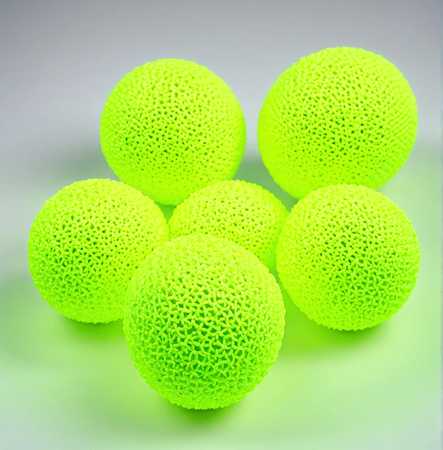 Original photograph of 3 neon yellow colored handballs