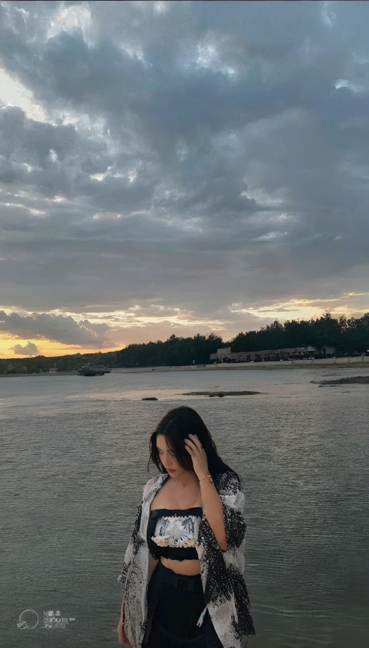 (Best quality, High resolution, Masterpiece :1.3), A tall and pretty woman, Slender abs, Dark brown hair styled in loose waves, Breasts, Wearing pendant, White button up shirt, Belt, Black skirt, (Modern architecture in background), Details exquisitely rendered in the face and skin texture, Detailed eyes, Double eyelid