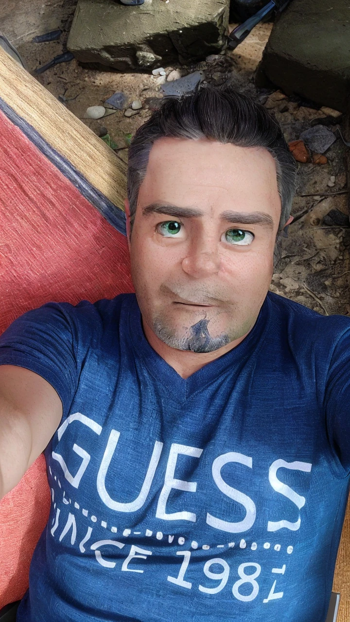 45-year-old man, short gray hair, green eyes, working in front of the computer, with an expression of astonishment at what he is seeing, white t-shirt with a green blouse, in the background we can see shelves with miniature cars. There is a cell phone on the table that is ringing.