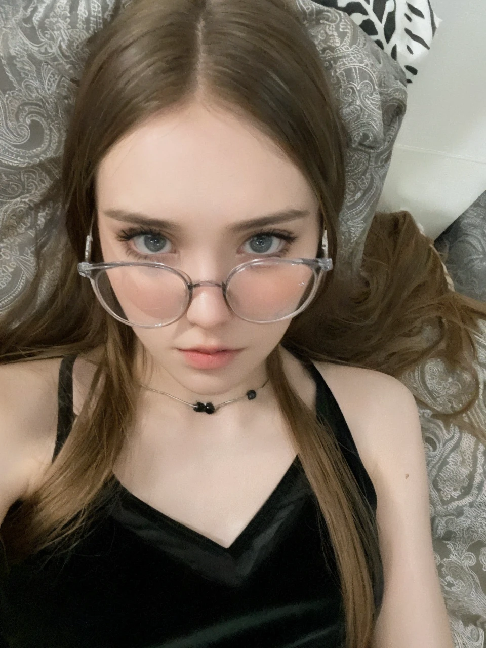 (RAW photo, best quality), (realistic, photo-realistic:1.2), 1girl, high quality, (high detailed skin:1.4), puffy eyes, glasses, gorgeous hair, (dark room:1.3), (rim lighting:1.3), (dimly lit:1.3), (dark night:1.3), indoors, portrait, black hair, dark background, short hair,