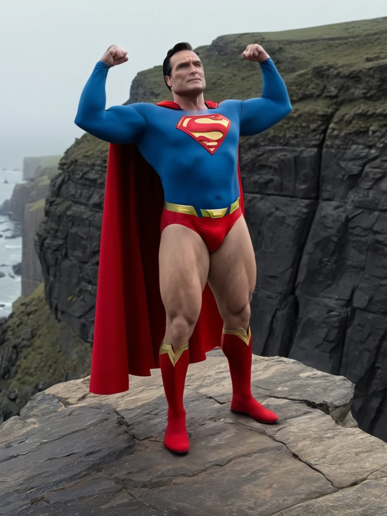 Cold, cloudy sky, middle-aged Superman, broad shoulders, protruding chest, thick neck, arms and thighs that have gained fat, no abdominal muscles, dull colored costume, Superman mark spread out to the sides, small red briefs bulging, cape fluttering in the strong wind, standing on a cliff