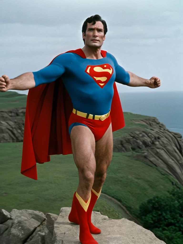 1970s, cold, cloudy sky, 70-year-old Superman, very broad shoulders, very protruding chest, very thick neck, arms and thighs that have gained fat, no abs, dull colored Superman costume, Superman mark spread out to the sides, small red briefs bulging, cape fluttering in strong wind, standing on a cliff