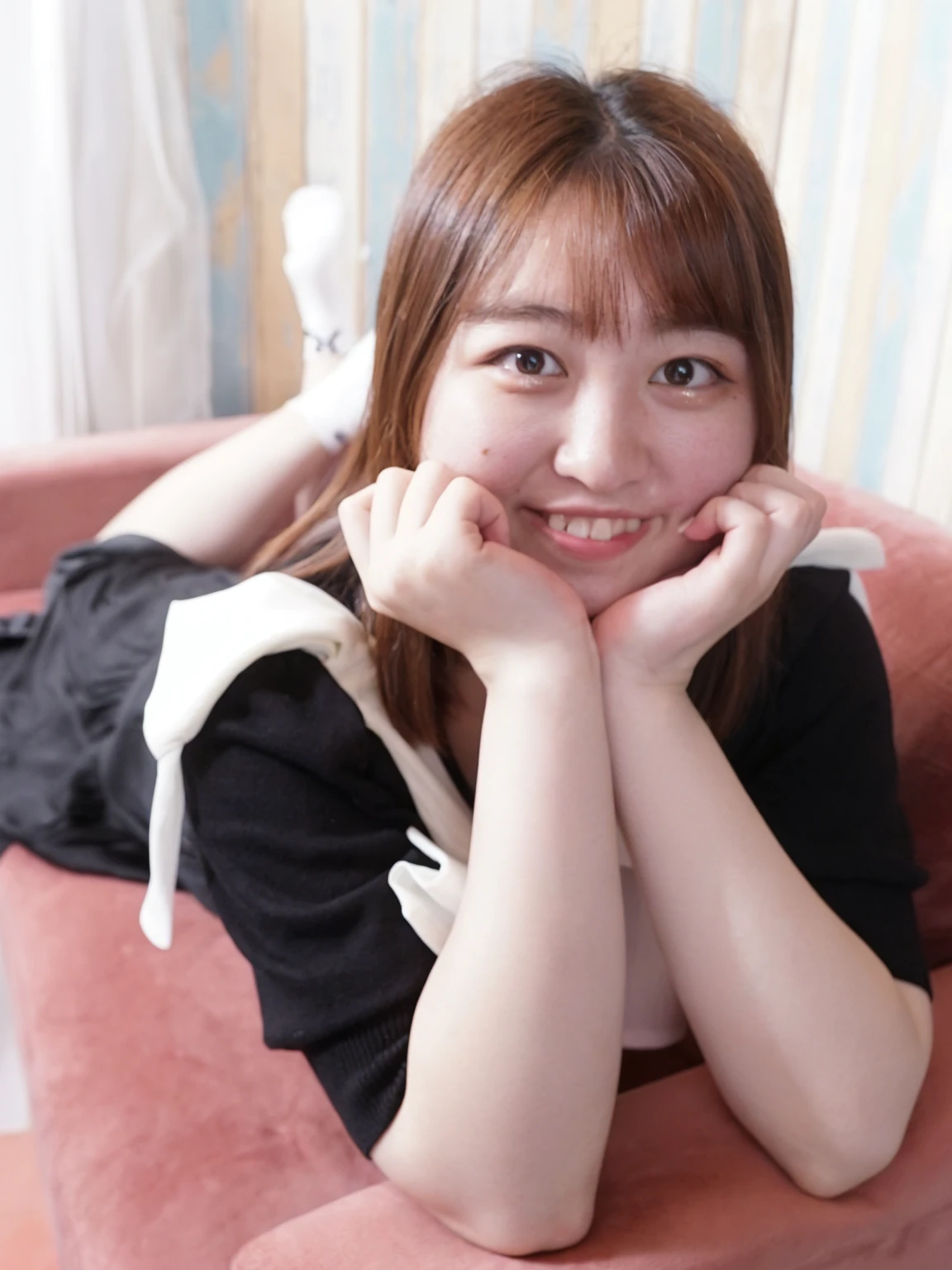 arafed asian woman sitting on a pink chair with her hands on her chin, relaxing and smiling at camera, pretty face with arms and legs, taken with canon eos 5 d mark iv, soft smile, taken with canon eos 5 d, taken with canon 8 0 d, young cute wan asian face, she is smiling, chiho, a cute young woman